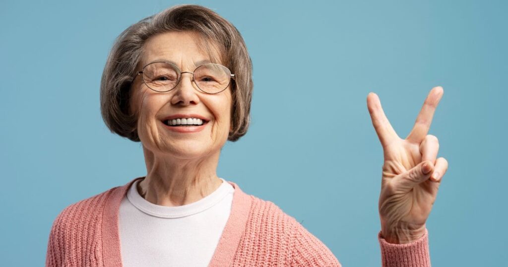 A calm senior adult with an emergency kit bag, looking prepared and confident while holding a flashlight