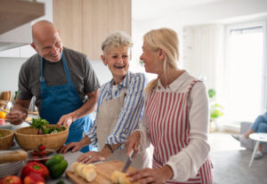 A group of seniors participating in a calm social activity such as cooking, gardening, or volunteering. Natural smiles, positive energy.